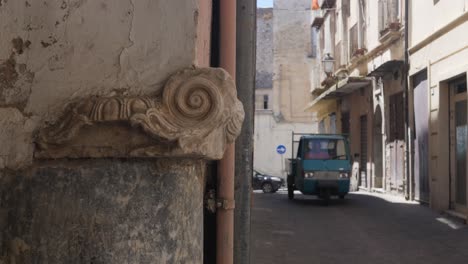 Tuk-Tuk-driving-through-ancient-streets-of-Formia-city,-handheld