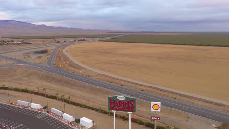 Harris-Ranch-sign,-California.-Drone-backwards-reveal