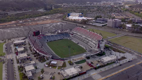 Snapdragon-football-stadium-in-San-Diego,-drone-orbit-looking-down,-then-tilt-up-reveal