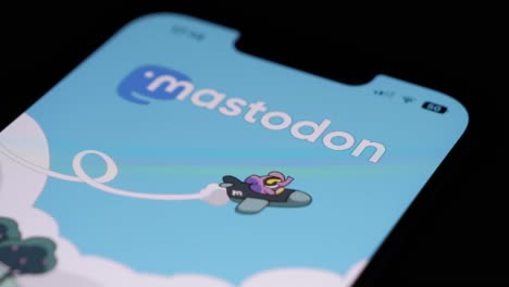 Smartphone-user,-opening-Mastodon-app