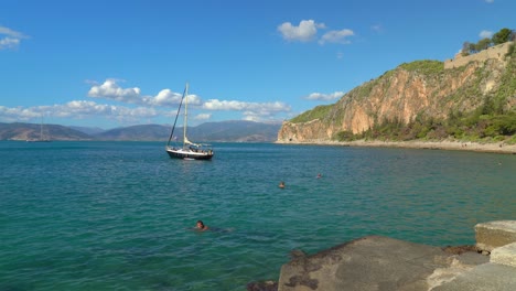 Yacht-with-Greece-Flag-Harboured-in-the-Bay-of-Nafplio