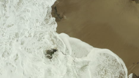 The-sea-waves-crashing-against-the-beachside