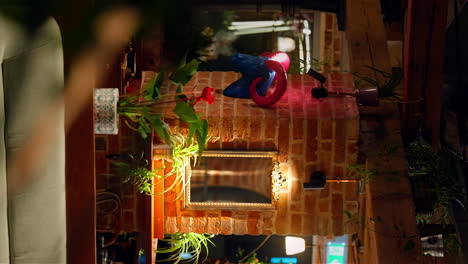 Quirky-colorful-faux-ram-decor-on-brick-wall,-cozy-Romanian-cafe-vertical-video