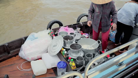 Water-vendor-boat-on-Can-Tho-floating-market,-selling-sweet-and-coffee