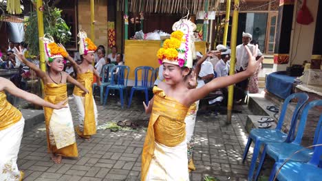Bali-Dancers,-Balinese-Hinduism,-Culture-in-Indonesia,-People-at-Temple-Ceremony-Performance-by-Group-of-Young-Girls