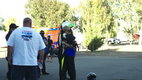 Racecar-driver-hugging-after-big-car-explosion-accident