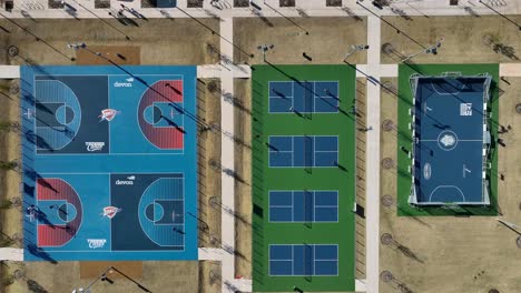 Top-down-aerial-view-of-Oklahoma-City-Thunder-basketball-courts-at-Scissortail-Park-in-OKC