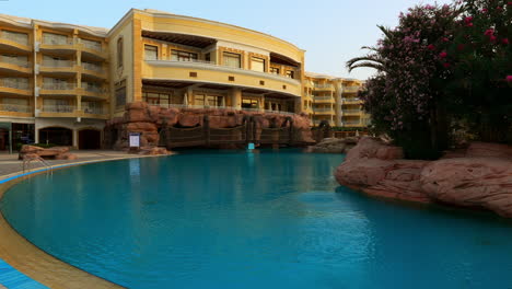 Poolside-View-of-Empty-Swimming-Pool-Area-Garden-At-Sentido-Palm-Royale-Hotel-Egypt-in-Early-Morning,-Resort-and-Tourism
