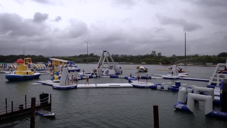 Lots-of-kids-playing-on-an-inflatable-floating-aquapark