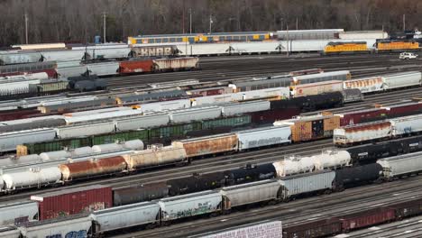 Railroad-yard-with-train-cars-and-rail-tracks