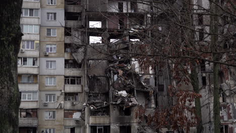Branches-sway-in-the-breeze-in-front-of-a-destroyed-tower-block-on-the-Saltivka-housing-estate-that-was-badly-damaged-during-fierce-fighting-as-Russian-invaders-tried-to-occupy-the-city