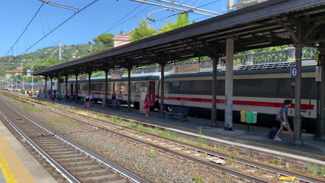 Passengers-depart-train-walk-towards-exit-at-Santa-Margherita-station-Italy