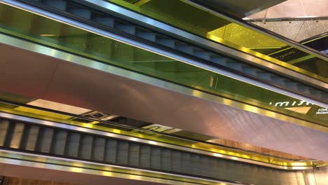 Top-view-of-escalator-or-moving-staircase-in-shopping-mall-during-Christmas-season