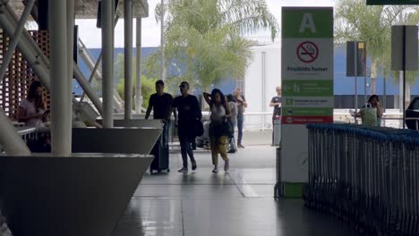 slow-motion-shot-of-travelers-entering-brasilia-international-airport