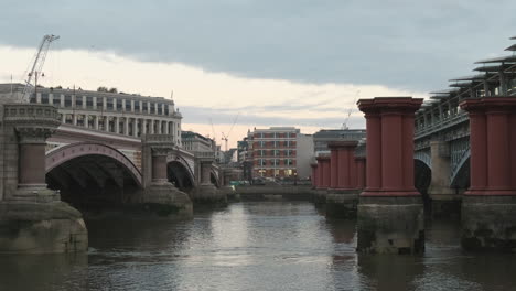 Blackfriars-Bridge-before-Restoration-and-Blackfriars-Station-with-Old-Red-Pillars-Protruding-From-River-Thames