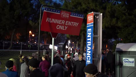 Crowd-Of-Marathoners-At-The-Entrance-With-Runner-Entry-Only-Sign-Hanging-At-Dawn