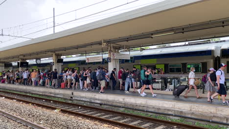 Passengers-exiting-the-train-station-after-the-train-dropped-them-off-in-Italy