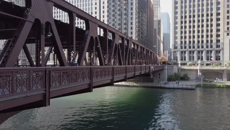 People-walking-across-a-bridge-over-the-Chicago-River