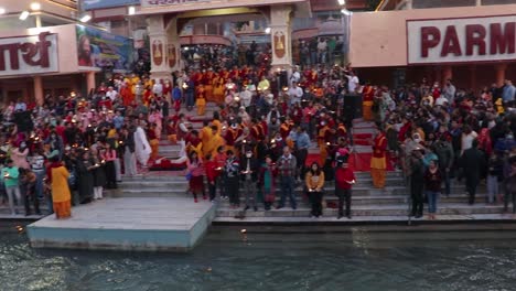 holy-ganges-river-evening-aarti-with-devotee-gathered-for-pryer-video-is-taken-at-parmarth-niketan-rishikesh-uttrakhand-india-on-Mar-15-2022