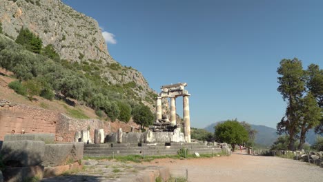 Tholos-of-Delphi-is-circular-temple,-a-tholos,-shares-the-immediate-site-with-other-ancient-foundations-of-the-Temple-of-Athena-Pronaia