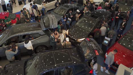 People-are-looking-at-cars-at-car-exhibitions-in-the-Hong-Kong-Harbour-City-mall