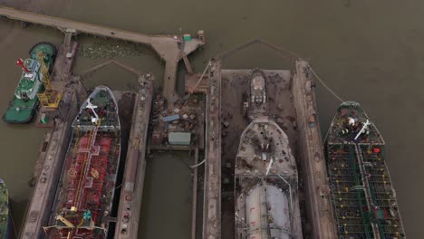 Aerial-view-of-ships-being-repaired-in-dry-dock