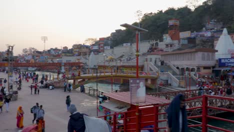 ganges-river-bank-with-devotee-crowed-at-evening-from-flat-angle-video-is-taken-at-har-ki-pauri-haridwar-uttrakhand-india-on-Mar-15-2022