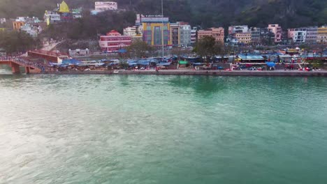city-building-wide-view-situated-at-holy-ganges-riverbank-at-evening-aerial-video-is-taken-at-har-ki-pauri-haridwar-uttrakhand-india-on-Mar-15-2022