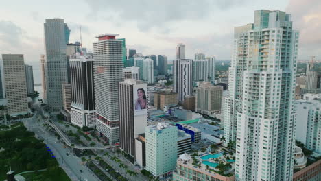 Aerial-establishing-shot-of-Miami-urban-neighborhood-with-tall-buildings-along-the-road