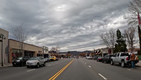 Driving-through-Tehachapi,-California-on-a-day-with-dramatic,-dark-clouds-in-the-sky