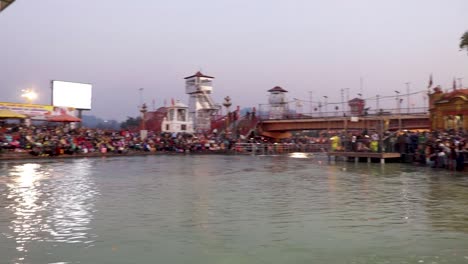 holy-ganges-river-evening-aarti-with-devotee-gathered-for-pryer-video-is-taken-at-har-ki-pauri-haridwar-uttrakhand-india-on-Mar-15-2022