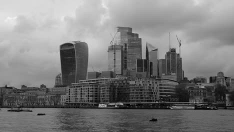 City-Of-London-Skyline-From-The-Queen's-Walk-In-London,-England---wide,-black-and-white