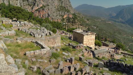 Treasury-of-Athenians-in-Delphi-Archaeological-Site-as-Visible-in-Background-on-Mountains
