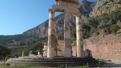 Tholos-of-Delphi-with-Massive-Mountain-Range-in-Background