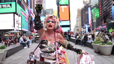 Expressive-Street-Performer-In-Vibrant-Dress-Singing-In-Times-Square-In-New-York
