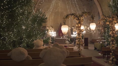 Ropazi-Lutheran-Church,-Latvia-December-3,-2022:-Light-Garden-in-Ropazi-Evangelical-Lutheran-Church-in-Advent-Time,-Christmas-Decor-of-Lights-With-Various-Figures-and-Teddy-Bears,-Festive-Atmosphere
