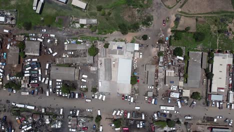 Drone-video-of-a-car-repair-business-area-at-a-high-density-suburb-township-in-Bulawayo,-Zimbabwe