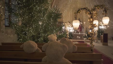 Ropazi-Lutheran-Church,-Latvia-December-3,-2022:-Light-Garden-in-Ropazi-Evangelical-Lutheran-Church-in-Advent-Time,-Christmas-Decor-of-Lights-With-Various-Figures-and-Teddy-Bears,-Festive-Atmosphere