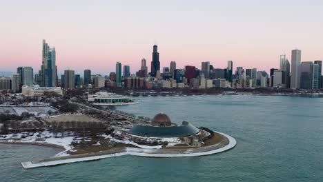 Aerial-view-towards-the-Adler-Planetarium,-vibrant,-winter-dusk-in-Chicago,-USA