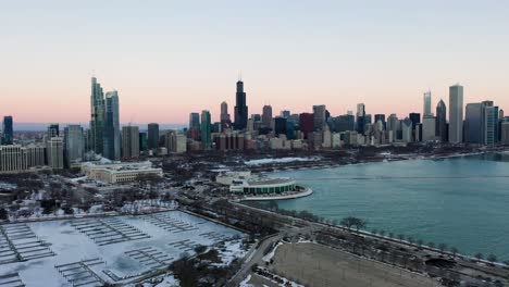 Aerial-view-towards-the-Shedd-Aquarium,-colorful,-winter-dusk-in-Chicago,-USA