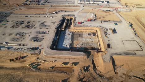 Aerial-pan-of-excavated-dirt-and-new-construction