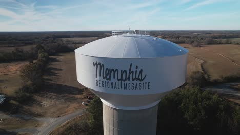 Aerial-orbital-of-water-tower-labelled-"Memphis-Regional-Megasite"-revealing-sprawling-new-construction