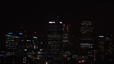 UK-November-2018---Slow-motion-of-a-barrage-of-fireworks-exploding-in-front-of-Canary-Wharf-financial-district-in-London-at-night
