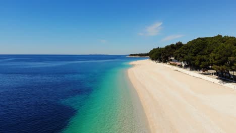 A-drone-shot-of-a-beach-in-Primosten-during-low-season