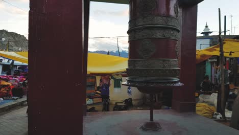 Reveal-shot-of-a-Prayer-wheel-in-the-streets-of-leh