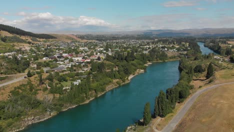 SLOWMO---Aerial-shot-of-historic-town-Clyde-in-Central-Otago,-New-Zealand