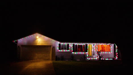 Outside-shot-of-suburban-house-decorated-with-Christmas-lights