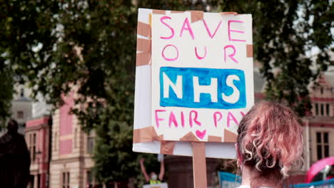 Save-our-NHS-fair-pay-protest-sign-in-London,-UK