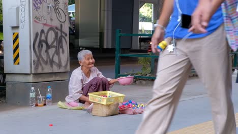 Elderly-Female-Thai-Begs-For-Money-On-The-Streets-Of-Bangkok