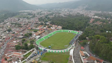 Aerial-view-around-the-Pensativo-stadium-in-Antigua,-Guatemala---orbit,-drone-shot